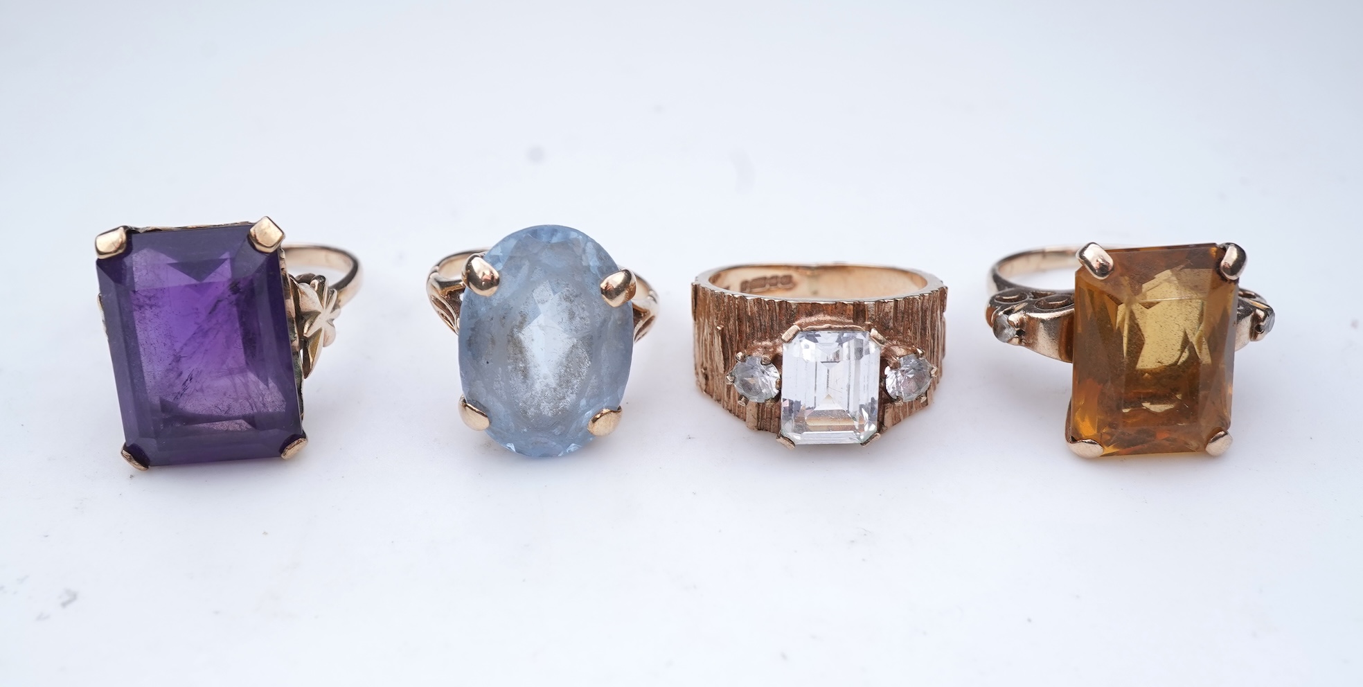 Four gem-set rings